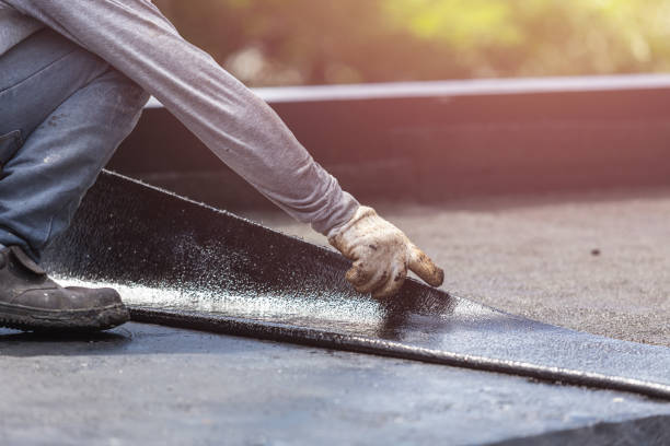 Professional Basement Waterproofing technician working in Lewistown, IL